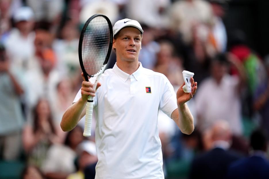 Jannik Sinner celebrating a tennis victory.