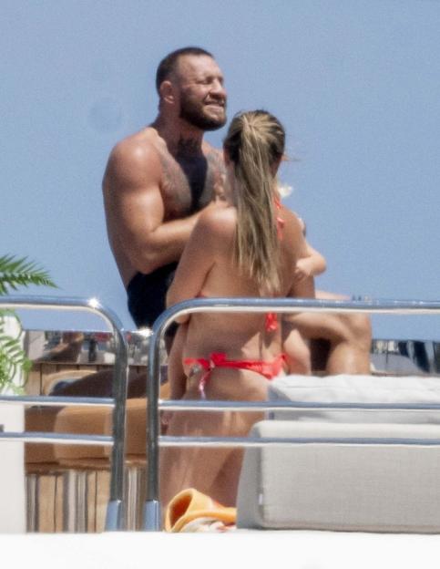BGUK_3299374 - *PREMIUM-EXCLUSIVE* PORTOCERVO, ITALY MUST CALL FOR PRICING BEFORE USAGE - UFC star Conor McGregor marked his 37th birthday in lavish fashion, celebrating with his family aboard a luxury yacht in the stunning coastal town of Porto Cervo, Sardinia...A cheeky Conor gets a little amorous with his longtime partner Dee Devlin, patting her on her bum as the pair soak up the sun, but Conor is surrounded by controversy as reports claimed the American rapper Azealia Banks has taken to social media to accuse Conor McGregor of sending her nudes, before leaking alleged X-rated photos of the UFC legend and he is also facing a new civil lawsuit filed by a woman accusing him of sexual assault during the 2023 NBA finals in Miami.....Pictured: Conor McGregor, Dee Devlin....BACKGRID UK 15 JULY 2025 ....UK: +44 208 344 2007 / uksales@backgrid.com....USA: +1 310 798 9111 / usasales@backgrid.com....*Pictures Containing Children Please Pixelate Face Prior To Publication*
