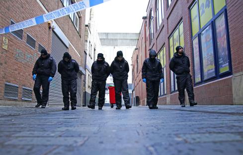 Police officers at a crime scene investigation.