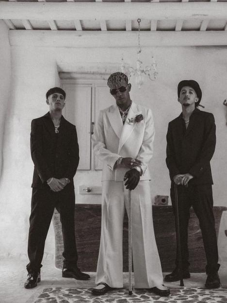 Black and white photo of three men in suits.