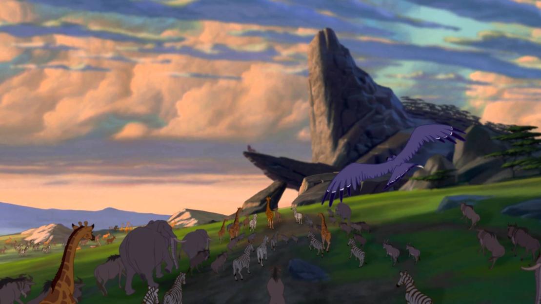 The Lion King: a large group of animals walking towards Pride Rock as Zazu flies overhead.