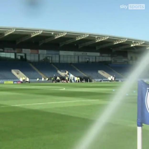 Sky Sports reporter soaked by stadium sprinklers.