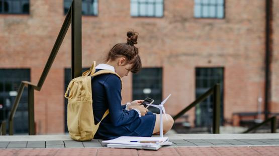 Schoolgirl working on a wind energy science project.