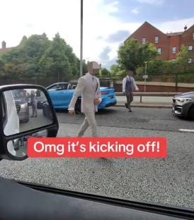 A wedding guest convoy erupts into a road rage incident on a busy road.