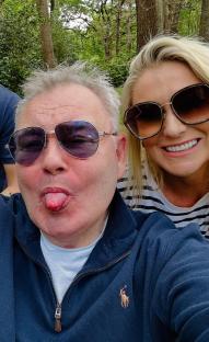 Eamonn Holmes and Katie Alexander smiling for a selfie.