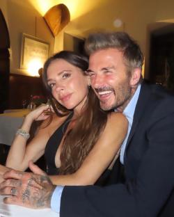 Victoria and David Beckham at a restaurant.