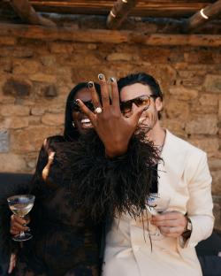 A woman showing off her engagement ring.