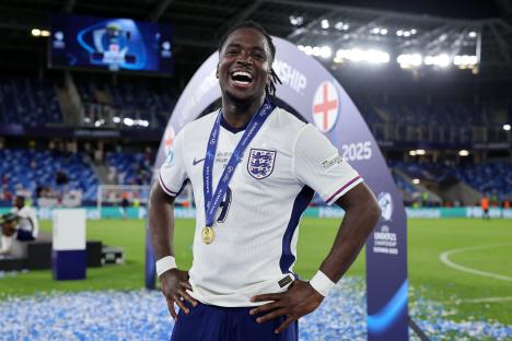 Jonathan Rowe of England smiles and holds his winner's medal after a UEFA European Under-21 Championship match.