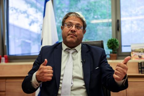 Itamar Ben-Gvir giving a thumbs-up during an interview.