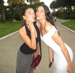 Dua Lipa and her sister Rina Lipa posing for a photo.