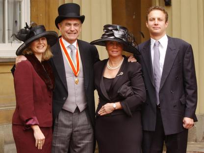 Sir Trevor Brooking with his family at Buckingham Palace after receiving a knighthood.