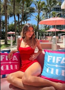 Diletta Leotta in a red dress at a FIFA Club event.