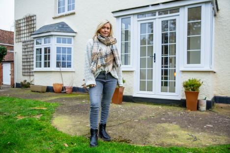 Suzanne Shaw standing outside her house.