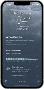 Smartphone screen showing a weather forecast for Jacksonville with a flood warning and hourly rain forecast.