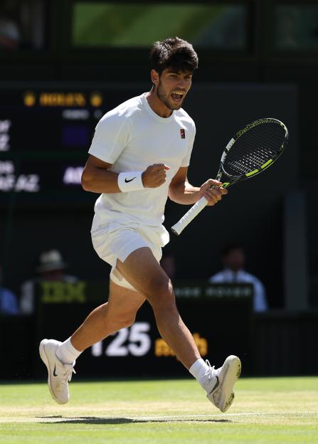 Carlos Alcaraz of Spain celebrates winning a point at Wimbledon.