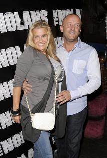 Kerry Katona and her husband Mark Croft at a concert.