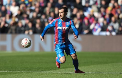 Ben Chilwell of Crystal Palace running with the soccer ball during a match.