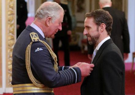 Prince Charles bestowing an OBE on Gareth Southgate at Buckingham Palace.