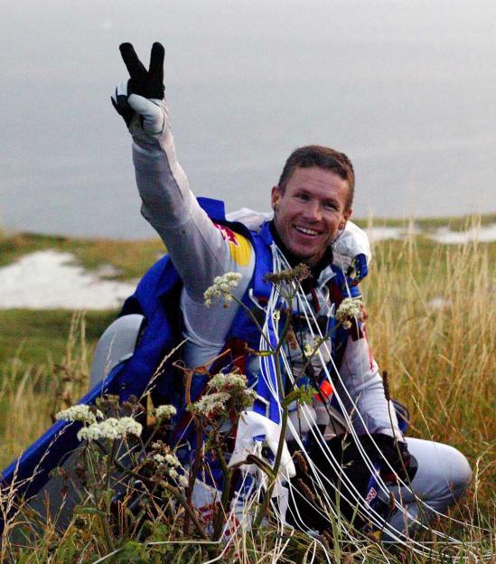 Skydiver Felix Baumgartner celebrating after a successful cross-Channel jump.