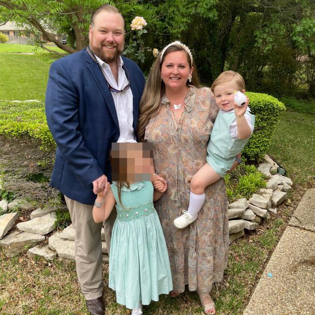 Photo of John and Julia Burgess with their two children.