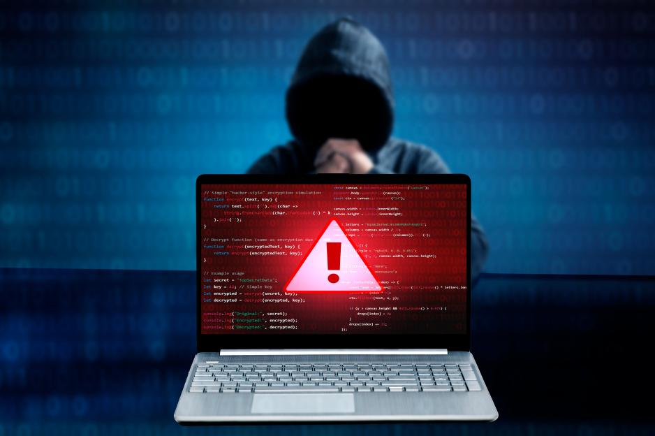 Illustration of a laptop displaying error code with a hooded figure in the background.