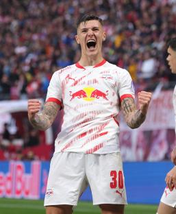 Benjamin Sesko of RB Leipzig celebrates scoring a goal.