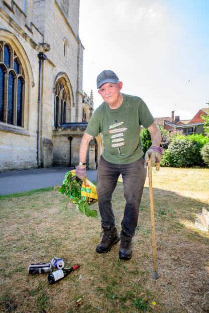 Man picking up litter in Trowbridge.