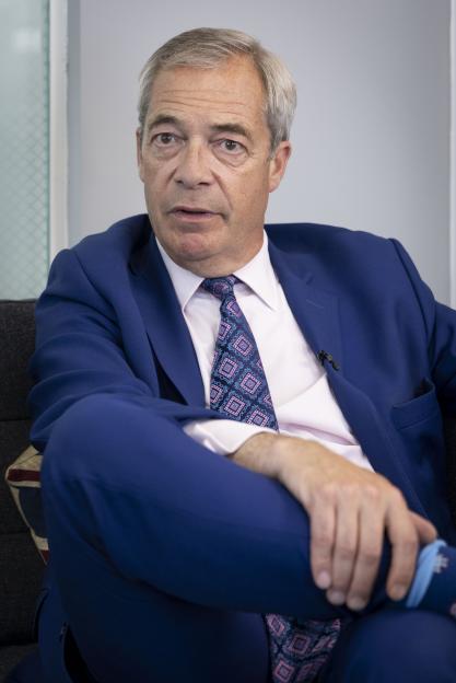 Nigel Farage in a blue suit.