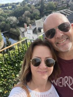 Selfie of a couple overlooking a French village.