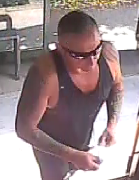 CCTV image of a man police wish to speak to regarding an incident involving a woman and children.