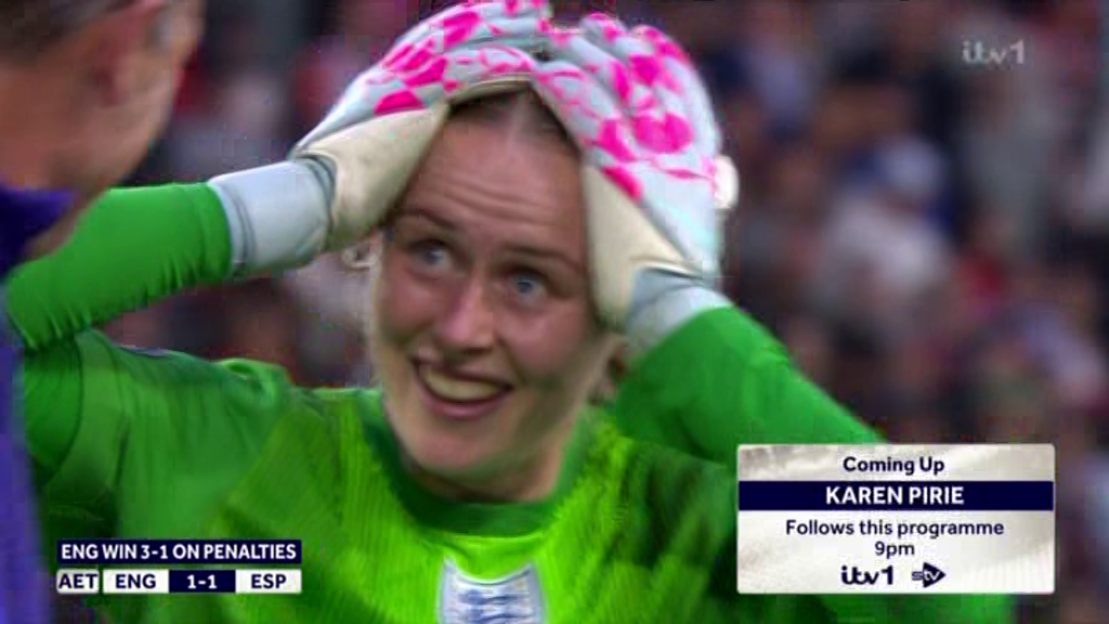 Screenshot of a joyful goalie, Karen Pirie, celebrating England's penalty shootout win.