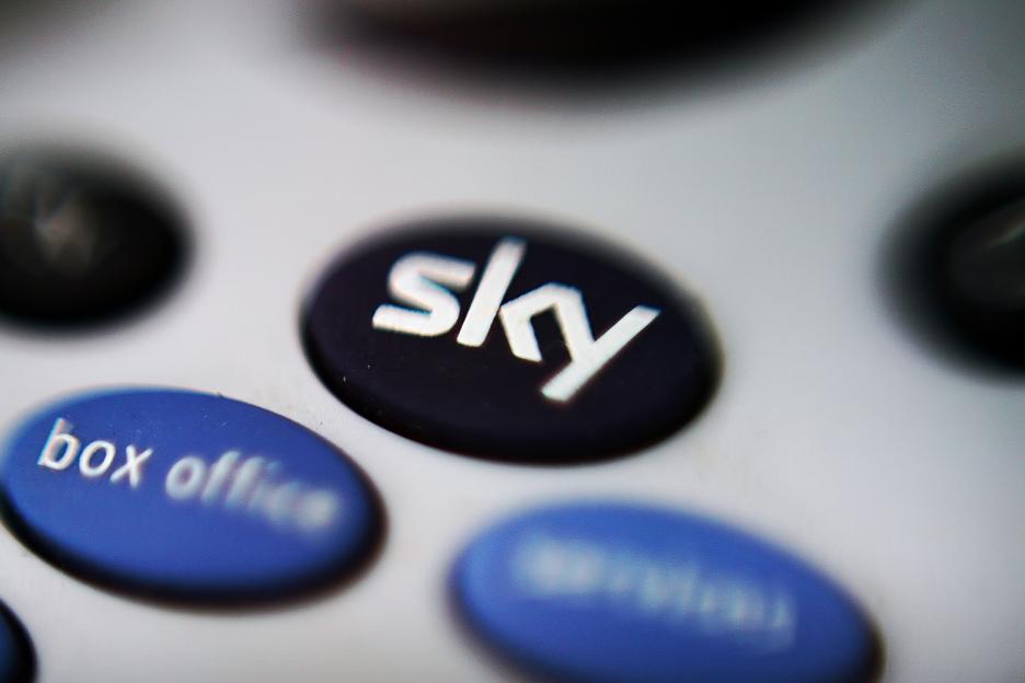 Close-up of a Sky remote control button.