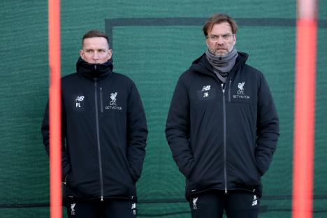 Jurgen Klopp and Pep Lijnders watching a Liverpool training session.