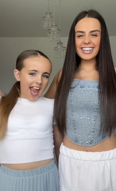 Two girls smiling for the camera.