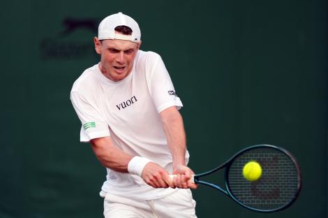 Jack Pinnington Jones playing tennis at Wimbledon.