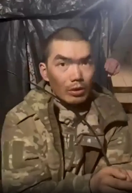 A man in military uniform speaking.