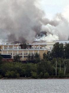 Smoke billows from a burning building.