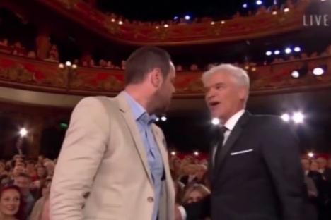 Danny Dyer giving Phillip Schofield a mean look at the British Soap Awards.