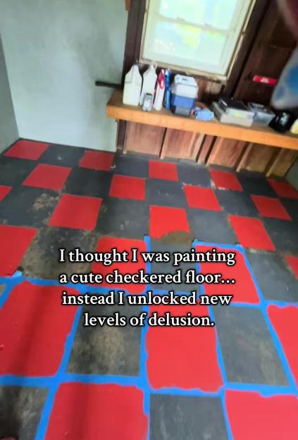 Red and black checkered floor paint job in progress.