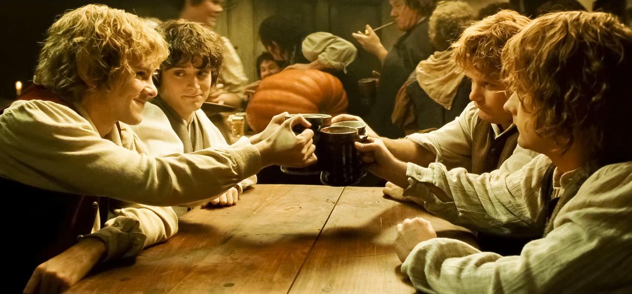 Scene from The Lord of the Rings: The Return of the King showing Merry, Pippin, and Samwise toasting.