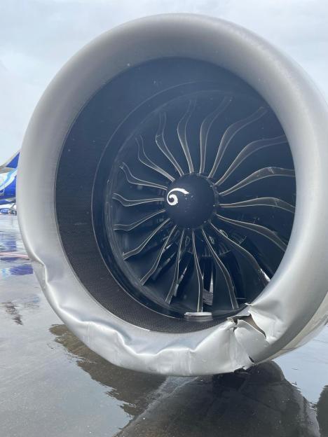 Damaged airplane engine casing.