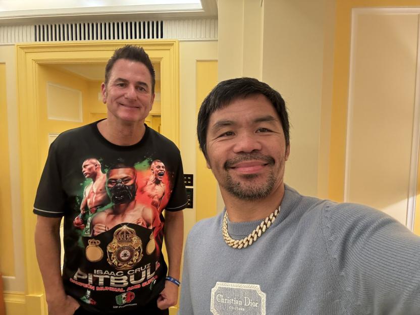 Manny Pacquiao and another man posing for a photo.