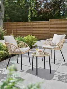Three-piece rattan bistro set with a glass-top table.