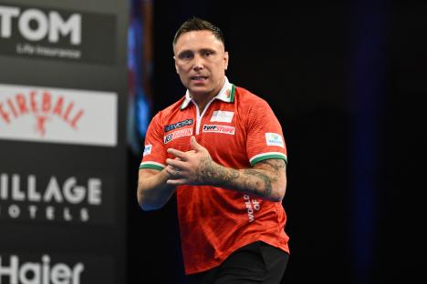 Gerwyn Price of Wales reacting during a darts match.
