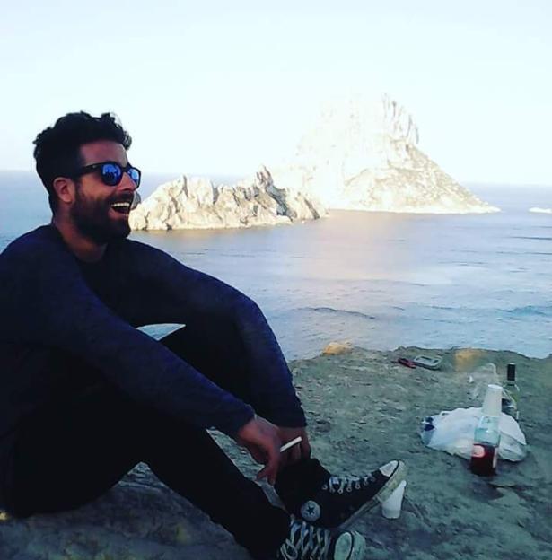 Michele Noschese, DJ Godzi, smiling by the ocean.