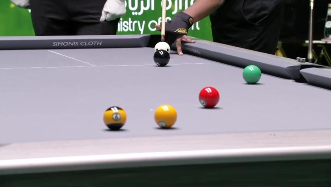 Pool player Johann Chua lining up a shot.