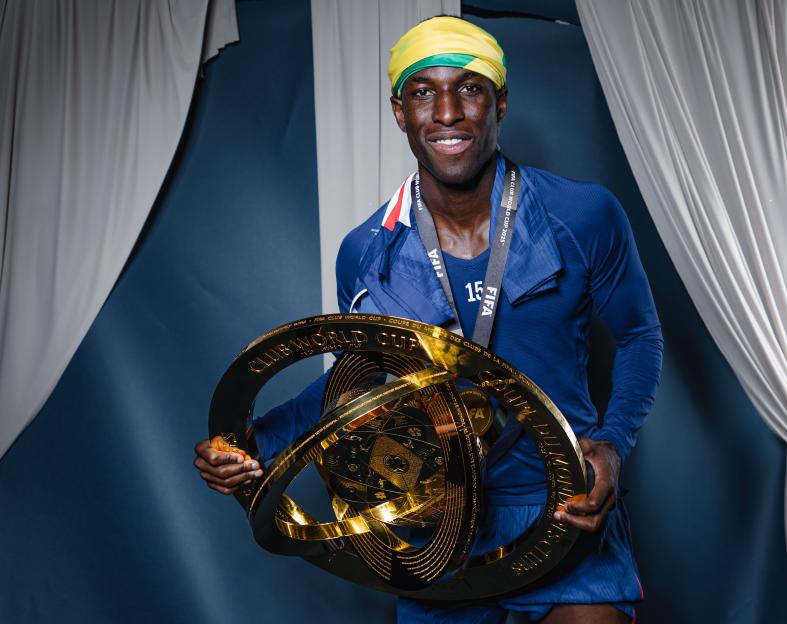 Nicolas Jackson of Chelsea FC holding the FIFA Club World Cup trophy.