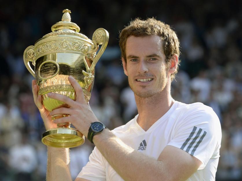 Andy Murray holding the Wimbledon Championship trophy.