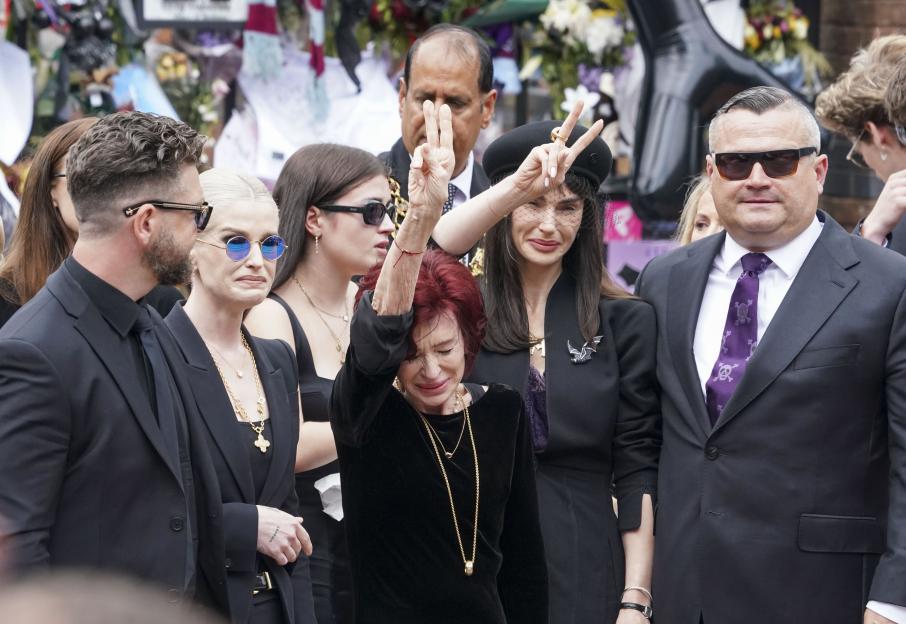 Jack, Sharon, and Kelly Osbourne view tributes to Ozzy Osbourne at his funeral.