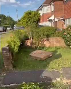 Dumped rubbish on a residential lawn.